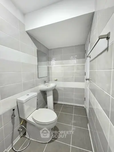 Modern bathroom with sleek tiles and contemporary fixtures