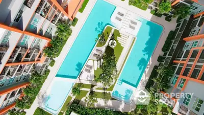 Stunning aerial view of modern apartment complex with large swimming pool and lush greenery.