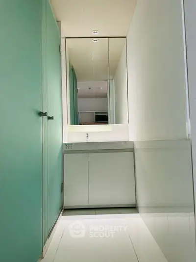 Modern minimalist bathroom with sleek design and large mirror
