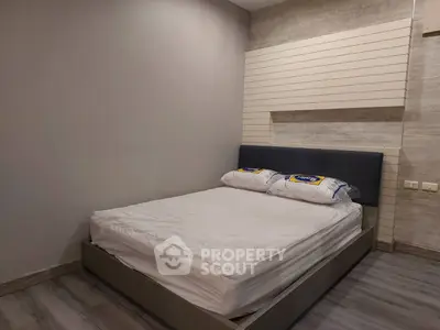 Modern bedroom with stylish bed and neutral decor