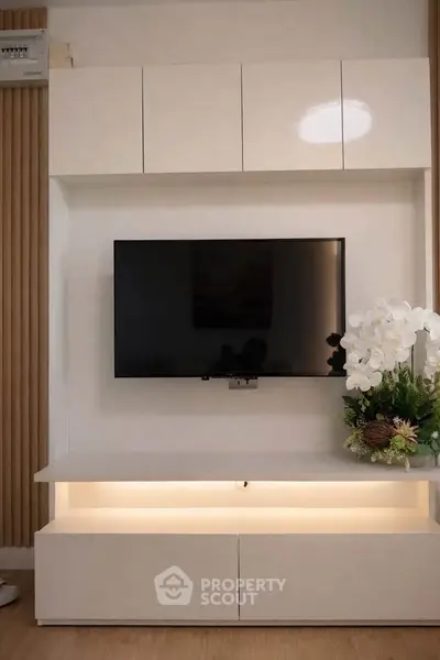 Modern living room with sleek TV unit and elegant decor