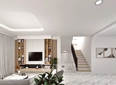 Modern living room with stylish decor and staircase, featuring sleek design and ample natural light.