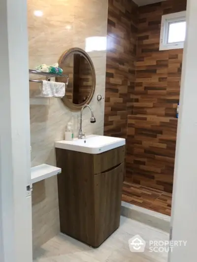 Modern bathroom with stylish wooden accents and sleek sink design