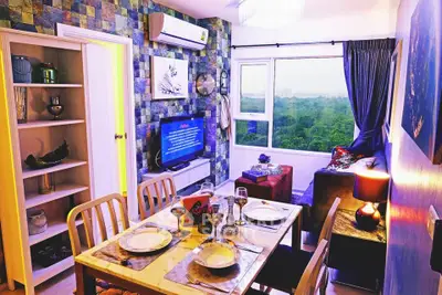 Charming living room with dining area and scenic window view in modern apartment
