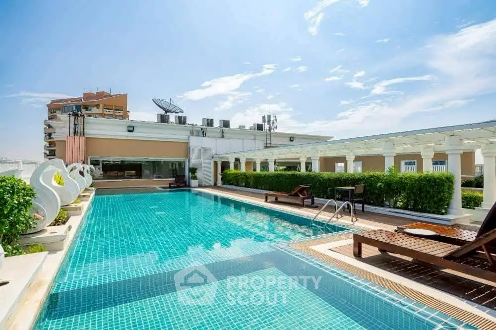 Luxurious rooftop pool with modern design and stunning city views, perfect for relaxation and entertainment.