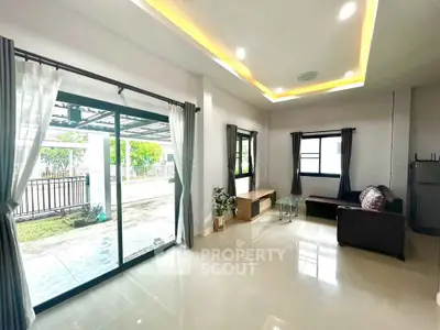 Spacious living room with modern design and large windows for natural light