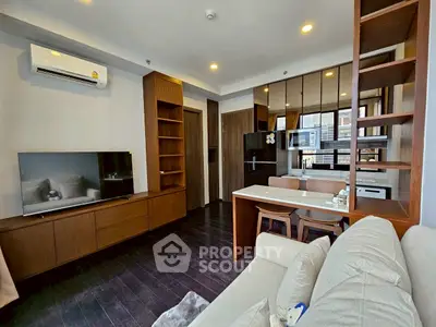 Modern living room with open kitchen and stylish wooden accents