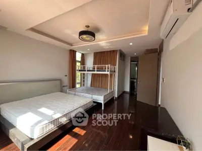 Spacious bedroom with modern bunk bed and natural light