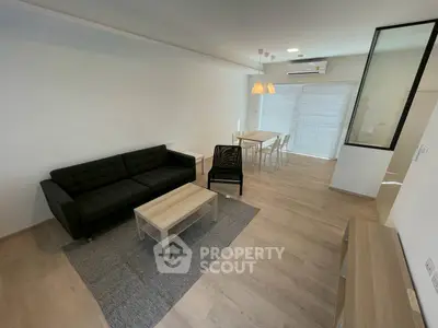 Modern living room with sleek furniture and natural light