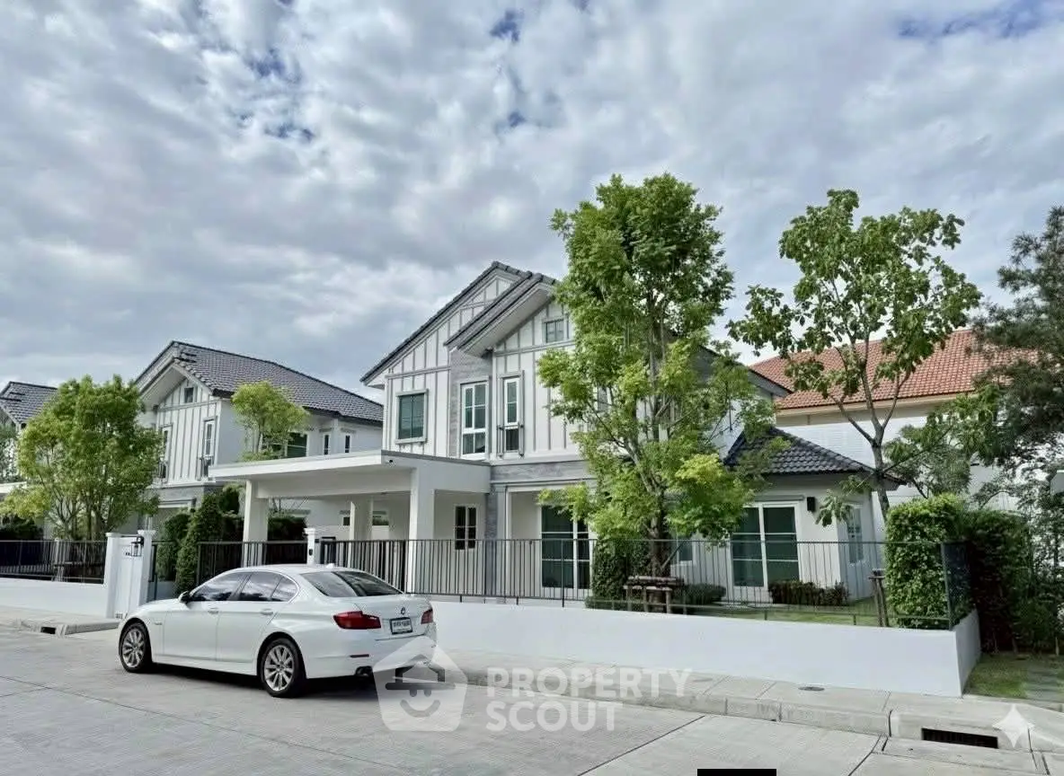 Charming suburban house with modern design and lush greenery