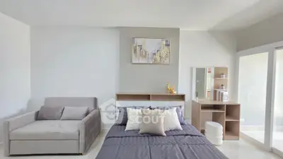 Modern bedroom with stylish decor and natural light