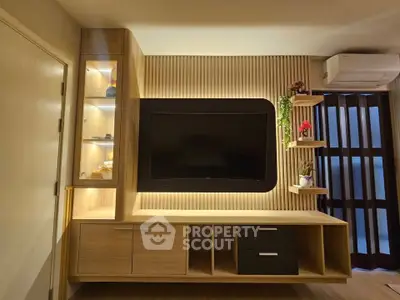 Modern living room with sleek wooden TV unit and ambient lighting