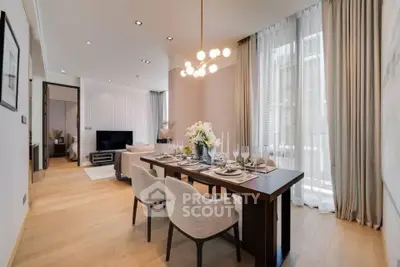 Luxurious open-plan living and dining area with elegant decor and natural light.