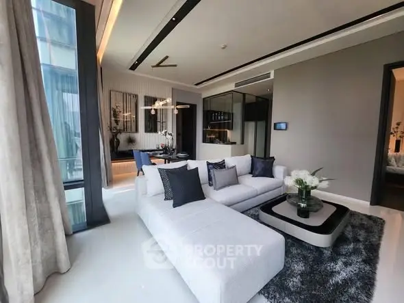 Luxurious modern living room with elegant decor and large windows