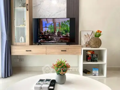 Modern living room with stylish TV setup and elegant decor