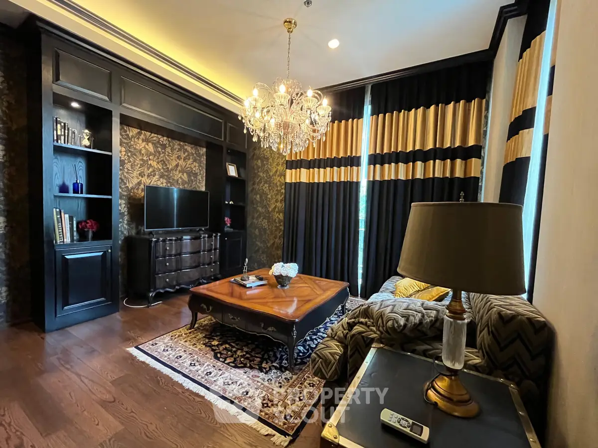 Luxurious living room with elegant chandelier and stylish decor