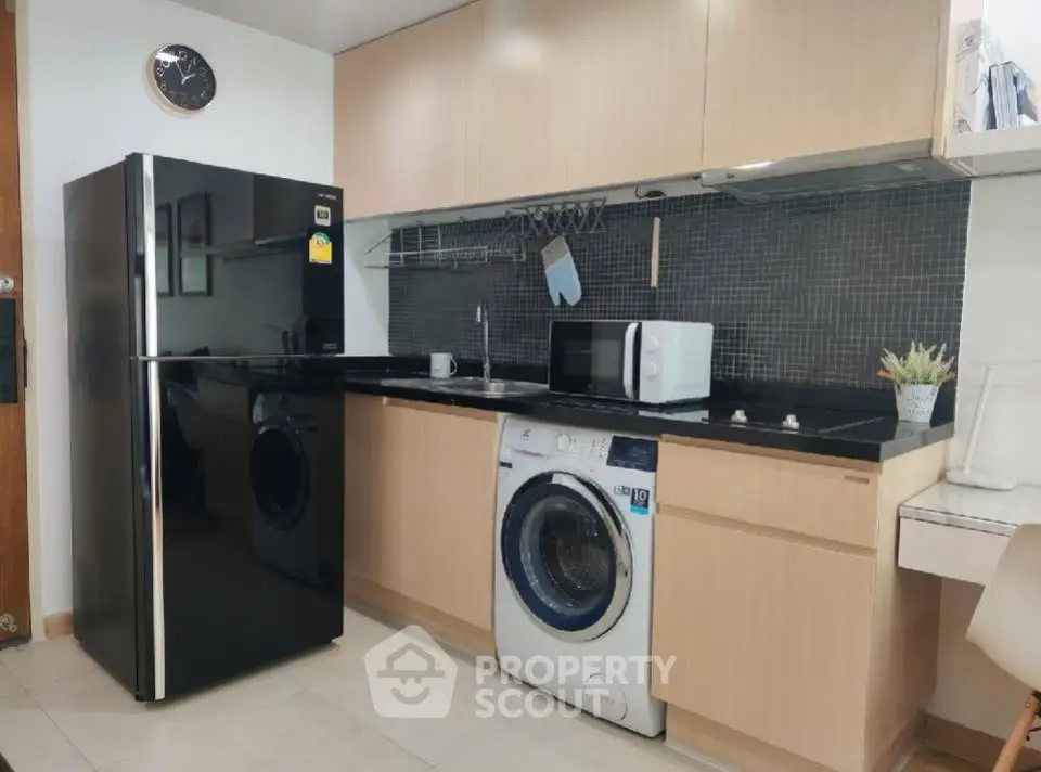 Modern kitchen with sleek appliances and stylish cabinetry