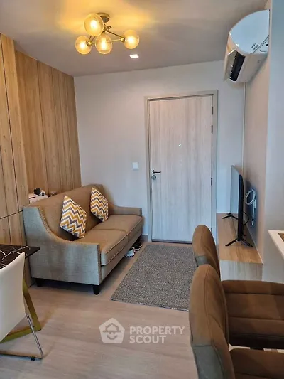 Modern living room with stylish lighting and cozy seating area