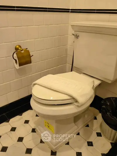 Elegant bathroom with classic white tiles and stylish flooring