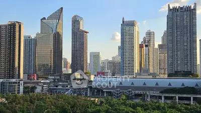 Stunning cityscape view of modern skyscrapers and lush greenery, showcasing urban living at its finest.