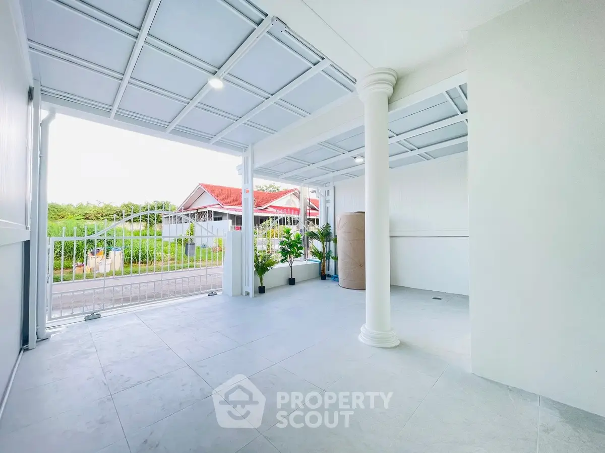 Spacious covered parking area with modern design and garden view