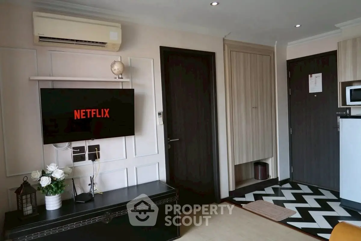 Modern living room with wall-mounted TV and stylish decor
