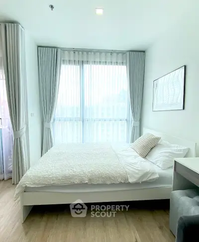 Bright and airy bedroom with large windows and modern decor