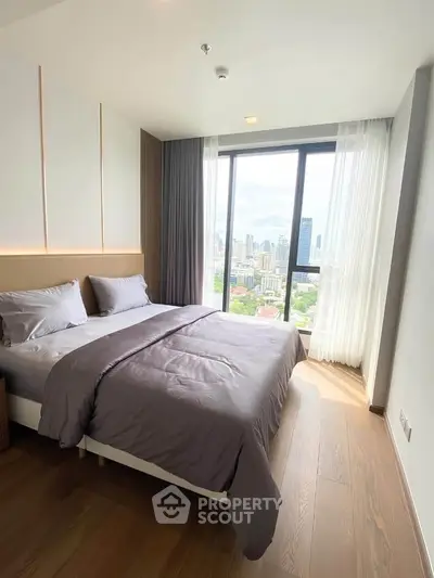 Luxurious bedroom with stunning city view and elegant decor