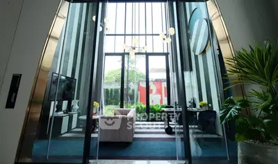 Luxurious modern living room with high ceilings and large windows overlooking a lush garden.