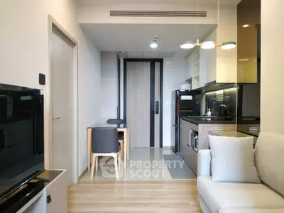 Modern apartment interior with open kitchen and cozy living area