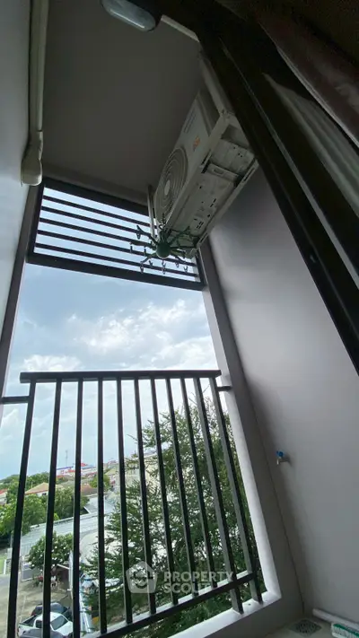 Modern balcony with outdoor air conditioning unit and scenic view