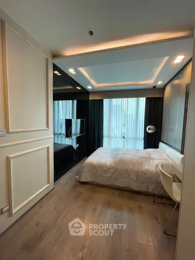 Modern bedroom with sleek design, featuring large windows and stylish lighting, perfect for urban living.