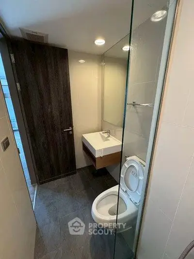 Modern bathroom with sleek design and glass shower partition