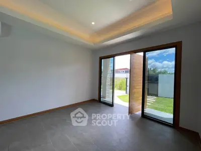 Spacious modern room with large windows and garden view, perfect for natural light lovers.