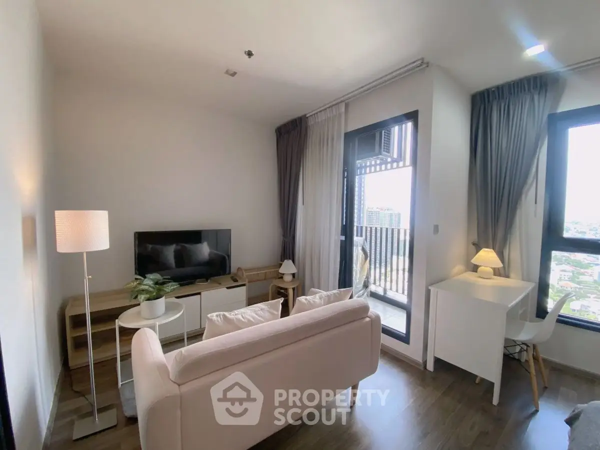 Modern living room with balcony view and stylish furniture