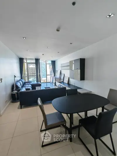 Spacious modern living room with sleek furniture and city view