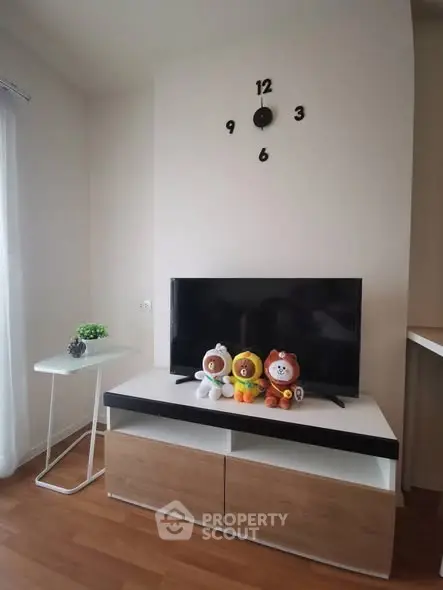 Modern living room with stylish TV stand and playful decor, perfect for cozy family gatherings.