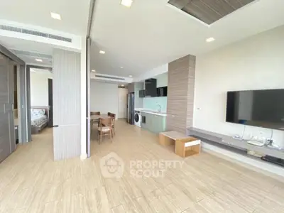 Spacious modern living room with open kitchen and dining area