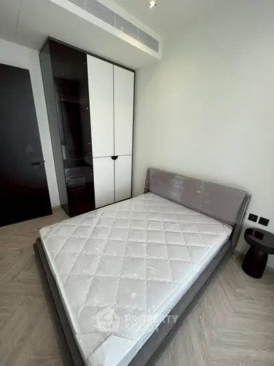 Modern bedroom with sleek wardrobe and minimalist design