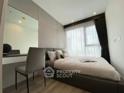 Modern bedroom with large window and elegant decor