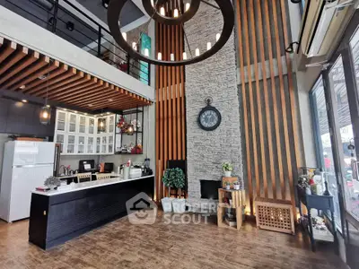 Modern living room with high ceiling, stylish decor, and open layout for a luxurious lifestyle.