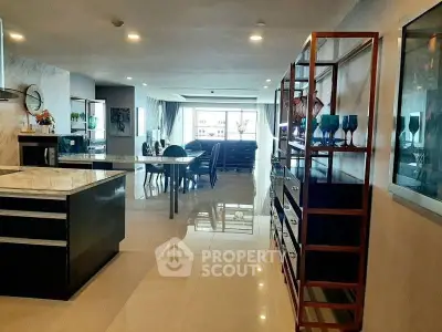 Spacious open-plan living and dining area with modern decor and ample natural light.