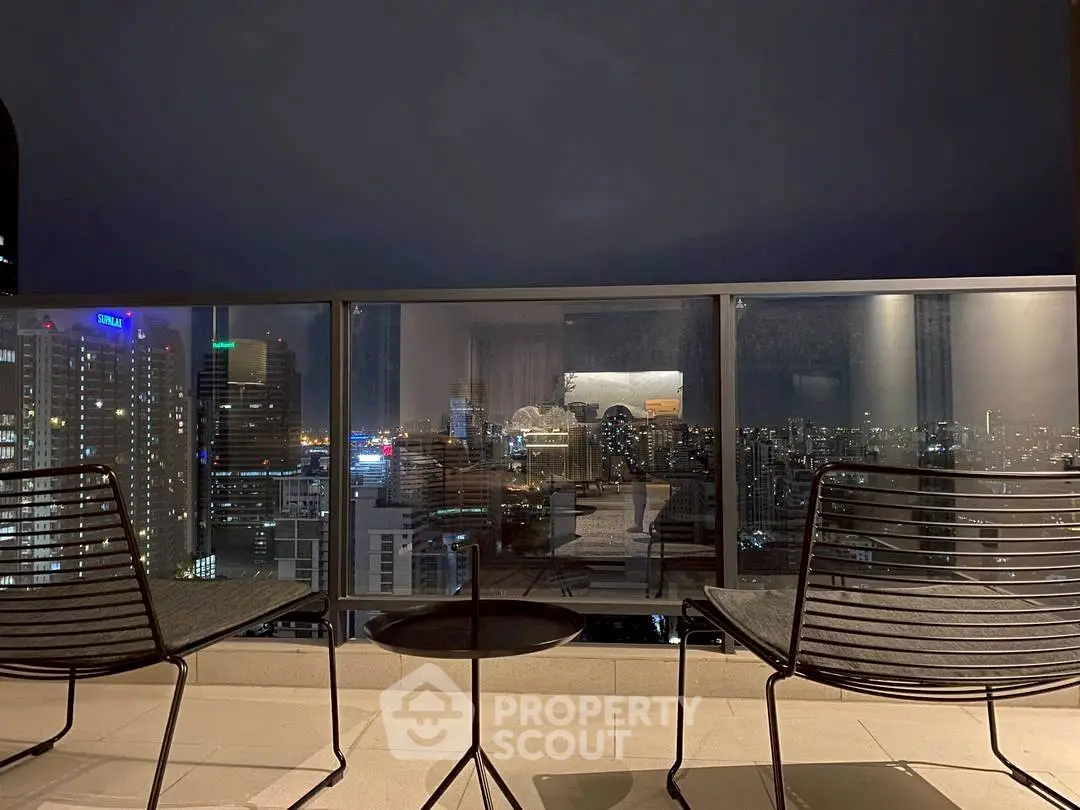 Stunning cityscape view from modern balcony with sleek seating, perfect for urban living.