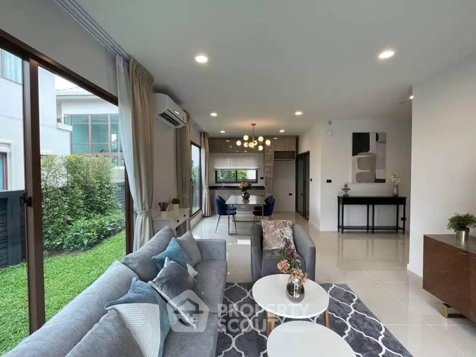 Spacious modern living room with garden view and elegant decor