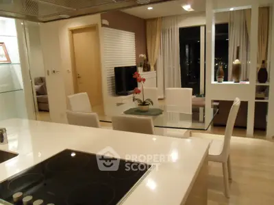 Modern open-layout kitchen and living room with sleek design and city view.