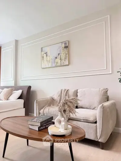Elegant living room with cozy seating and stylish decor, perfect for modern living.