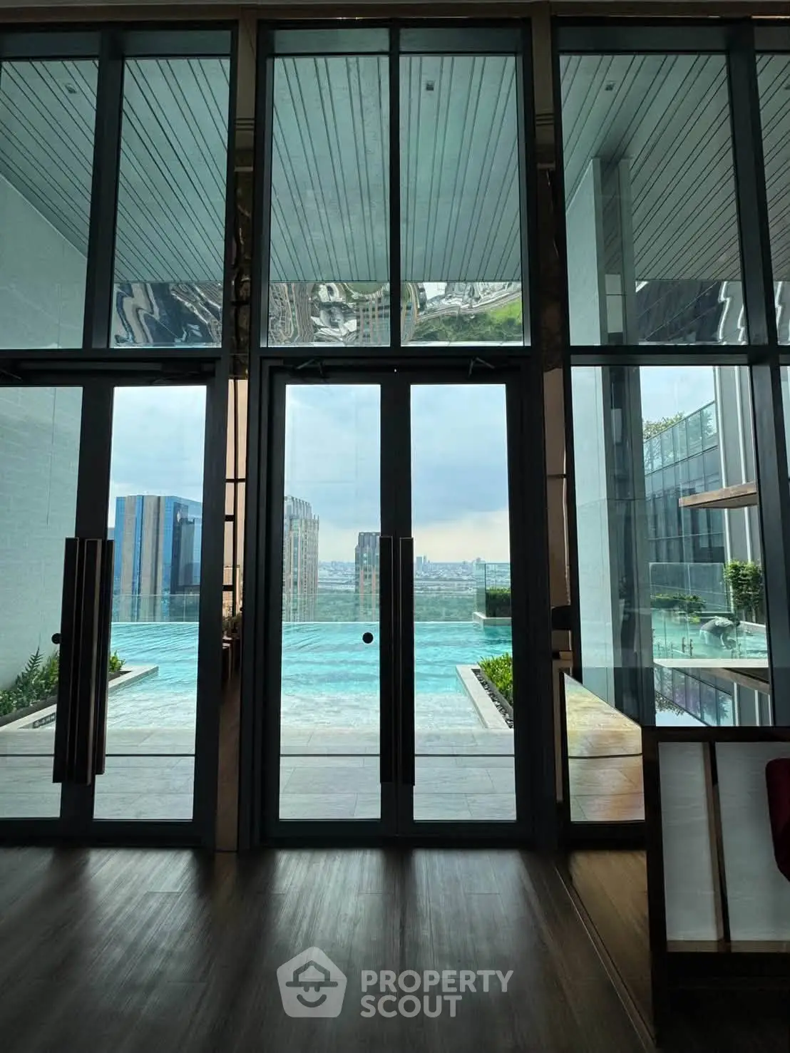 Luxurious high-rise building with stunning pool view and modern architecture.