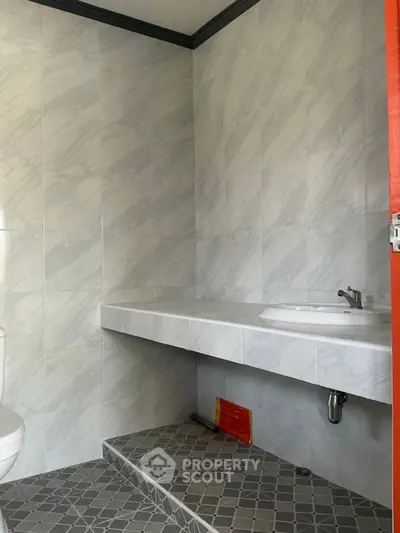 Modern bathroom with sleek tiles and minimalist design