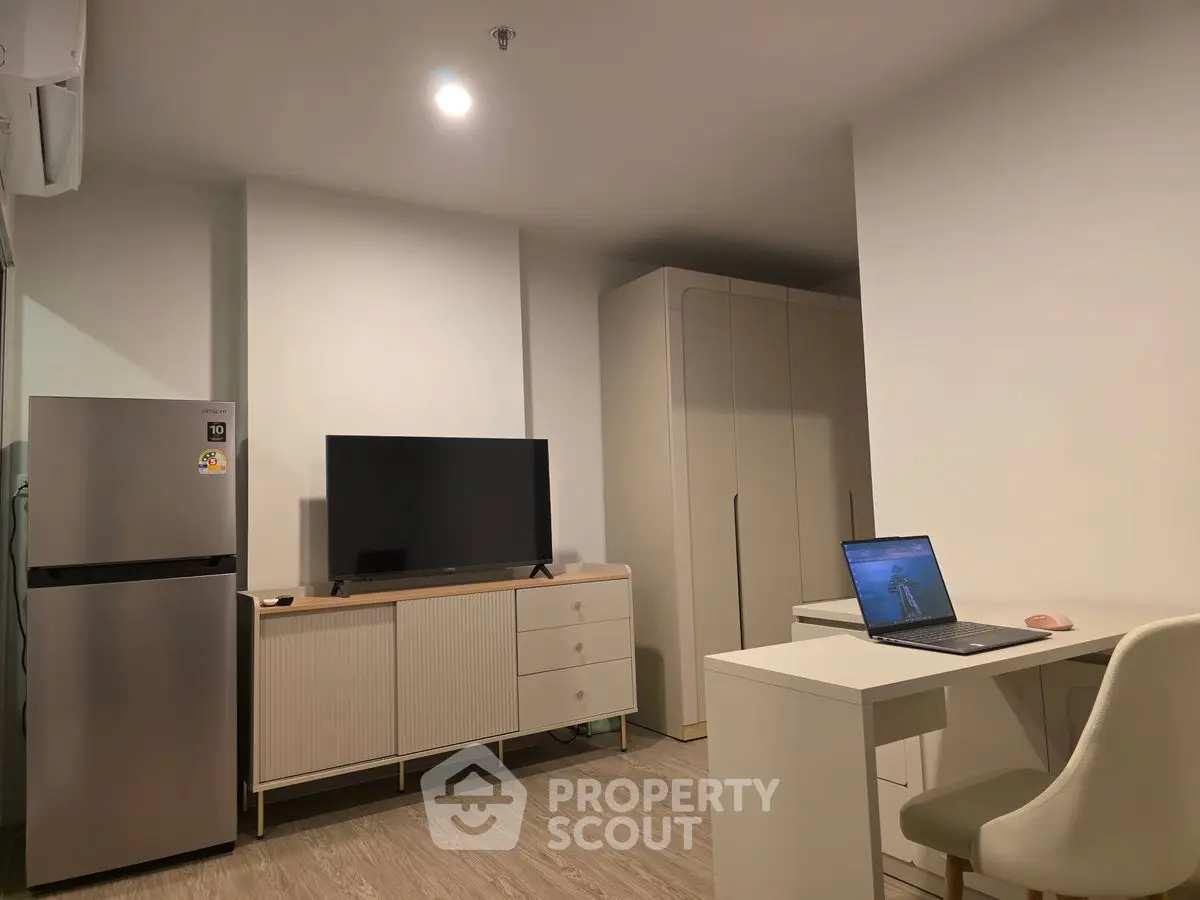 Modern studio apartment with sleek furniture and appliances