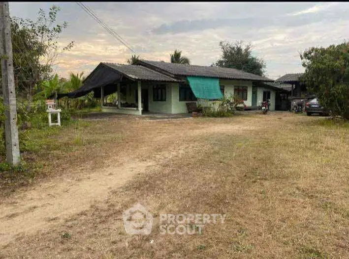 Charming rural house with spacious yard and rustic appeal, perfect for countryside living.